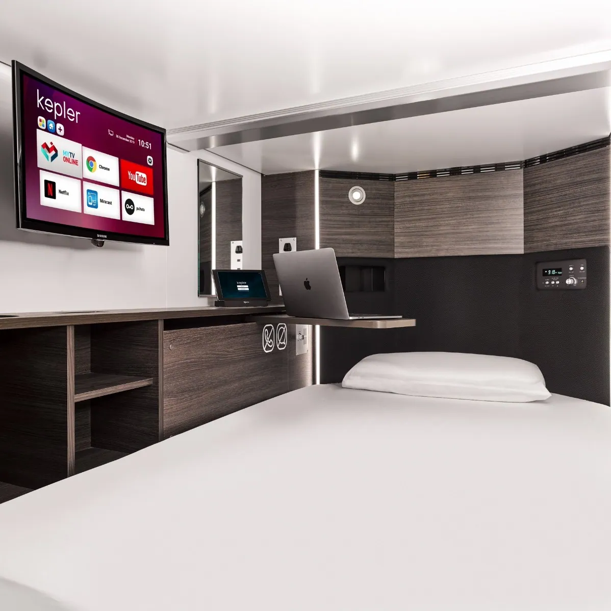 Private airport sleeping pod interior with smart amenities at Kepler transit hotel and sleep lounge