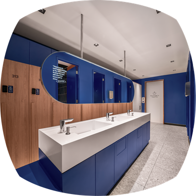 Shower areas equipped with essential amenities like shampoo, lotion, and towels.
