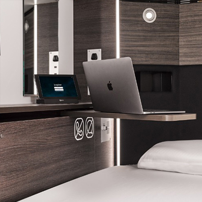 Order water, mask, and ear plugs via the bedside tablet—delivered by Kepler's special robot.